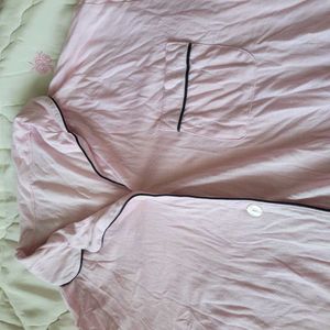 This Victoria's Secret satin pajama top features a