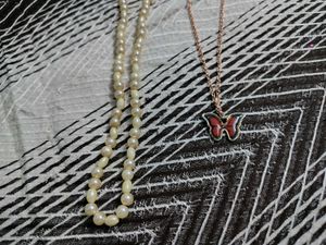 Elegant Pearl Necklace and Butterfly Pendant