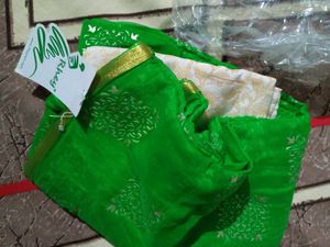 Vibrant Green Saree with Intricate Gold Motifs