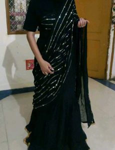 Elegant Black Saree with Golden Embellishments