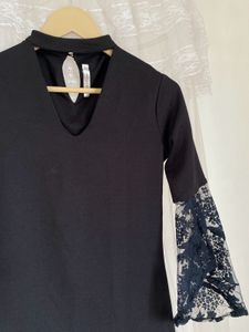 Elegant Black Top with Lace Bell Sleeves
