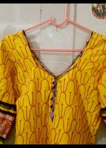 a )Yellow Printed Kurti with knot at back