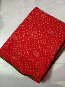 Vibrant Red Bandhani Saree with Elephant Border