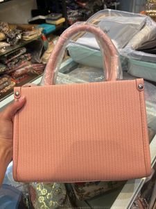 Stylish Pink Textured Handbag