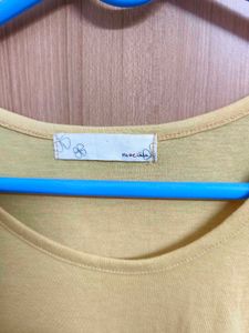 Yellow Sleeveless Top with Ruffle Hem