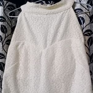 Fish tail gown with round neck.