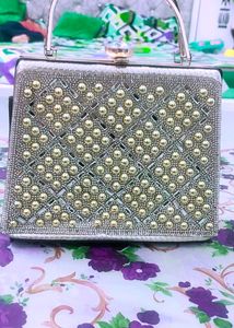 Elegant Beaded Silver Clutch