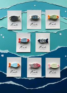 Fish brooches
