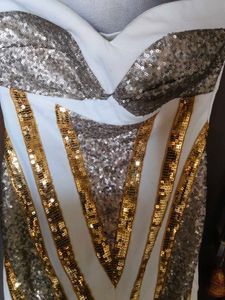 Cleopatra off-shoulder dress.