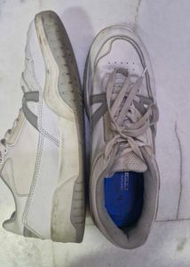 Worn White Sneakers
