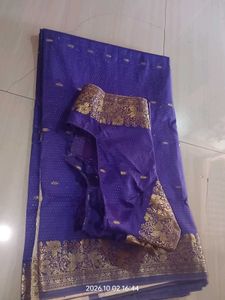 a purple saree with silver dotted design