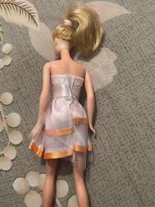 leo Barbie Doll with Pink Dress