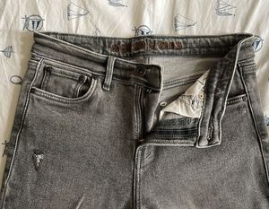 Grey Flare Jeans with Distressed Details