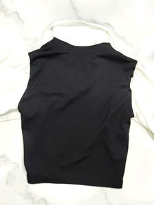 A great black top with white sleeves and collar.