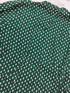 A beautiful dark green short kurti with embellish