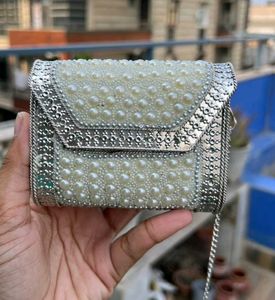 Elegant Pearl Embellished Clutch from Snatcher