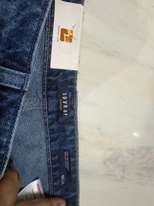 Distressed Blue Denim Jeans