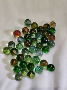 40 pieces colourful shiny glass marbles.