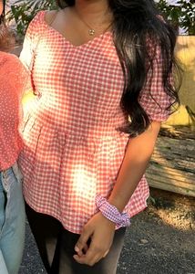 Gingham print pink peplum top