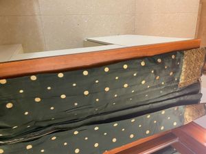 Elegant Dark Green Saree with Gold Polka Dots