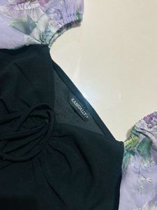 Chic Black Top with Floral Puff Sleeves