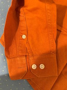 orange shirt from snitch