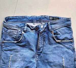 Distressed Blue Denim Jeans