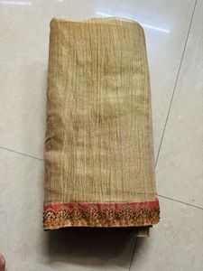 Elegant Gold Saree with Pink Border