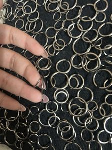 Black Sleeveless Top with Ring Embellishments