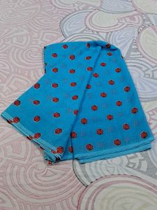 Blue Saree With Red And Some White Dots.