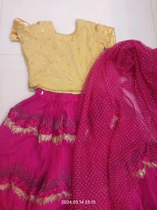 golden choli and dark pink ghaghra with duppatta