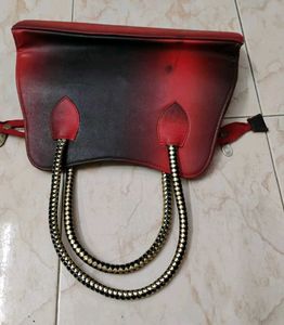 Stylish Handbag with Snake Handle Design