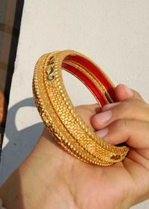 Exquisite Gold-Tone Bangles with Red Enamel Inlay