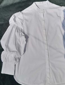 White balloon-sleeve shirt.