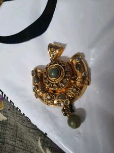 Designer Gold Tone Pendant with Green Stones