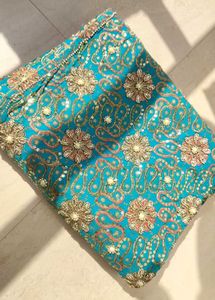 Stunning Teal Saree with Intricate Embellishments