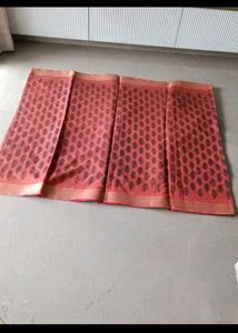 Beautiful Red Saree with Intricate Black Motifs