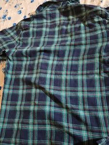 Classic blue and teal checkered full-sleeve shirt.