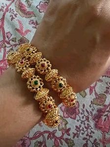 Elegant Gold Bangle with Stone Embellishments