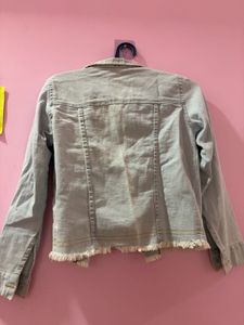 Light Wash Denim Jacket with Frayed Hem