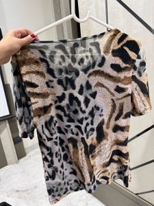 Chic Animal Print Top with Embellished Neckline