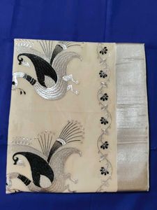 Elegant Cream Saree with Peacock Design