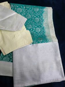 Elegant Teal Saree with Silver Floral Motifs
