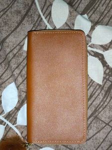 Stylish Tan Wallet with Pom-Pom Charm