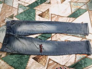 Distressed Blue Denim Jeans