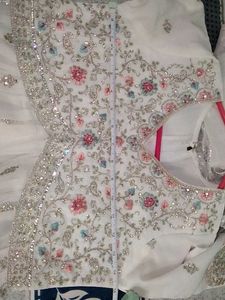 Farashi sharara and peplum top fully embroidered.