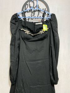 Elegant Black Dress with Embellished Neckline