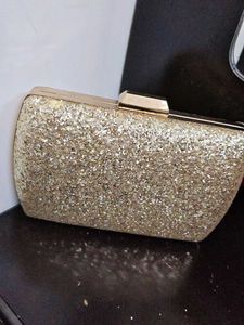 styling and charming gold clutch