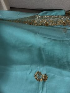 Elegant Teal Saree with Golden handwork  Border