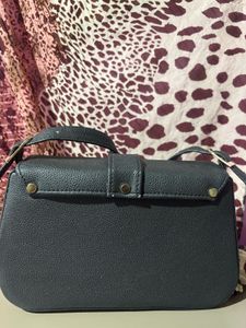 Chic Black Crossbody Bag with Gold Buckle